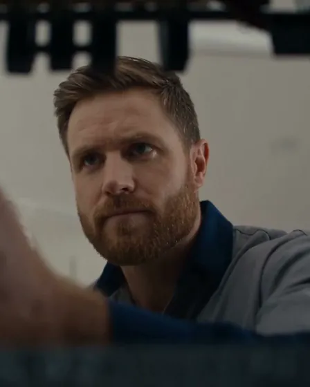 Nathan Faulkner mid-isolation at an open switchboard, screwdriver in hand